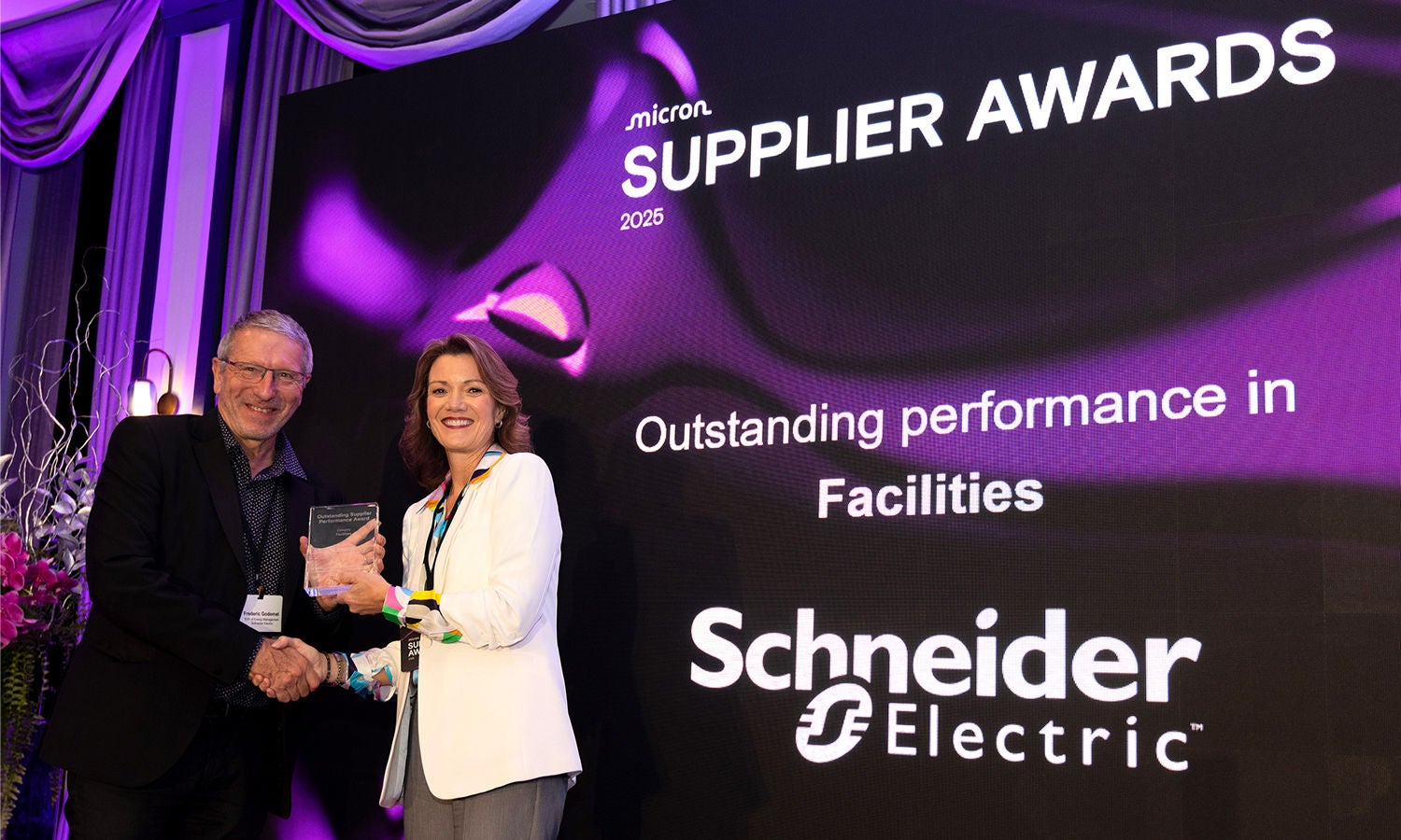 Beth Elroy presenting the Outstanding Performance Award to Frederic Godomel